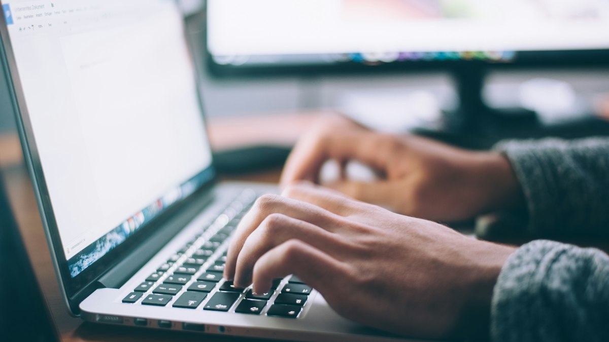 Person using a laptop to find a job in Australia