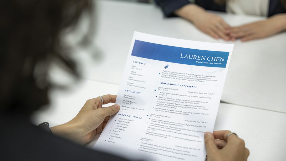 Woman reviewing a resume in the Australian resume format